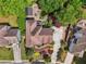 Aerial view of the home showcasing the large roof, driveway, and lush, private landscaping at 3282 Green Farm Trl, Dacula, GA 30019