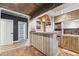 Finished basement bar featuring a bar sink, custom cabinets and seating at 3282 Green Farm Trl, Dacula, GA 30019