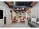 Finished basement featuring a stone fireplace and custom seating at 3282 Green Farm Trl, Dacula, GA 30019