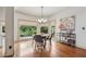 Bright breakfast nook with large windows overlooking a lush backyard at 3282 Green Farm Trl, Dacula, GA 30019