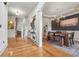 Open dining room with wood floors, modern chandelier, and wainscoting at 3282 Green Farm Trl, Dacula, GA 30019