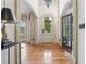 Grand foyer with soaring ceilings, hardwood floors, and ornate details at 3282 Green Farm Trl, Dacula, GA 30019