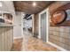 Finished basement hallway featuring a small wine rack and rum barrel at 3282 Green Farm Trl, Dacula, GA 30019