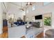 Bright living room with hardwood floors, large windows, and high ceilings at 3282 Green Farm Trl, Dacula, GA 30019
