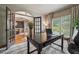 Bright office with French doors, large windows, and a modern desk at 3282 Green Farm Trl, Dacula, GA 30019