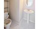 Cozy half bathroom featuring modern sink and fixtures, with toilet to the side at 3601 Gainesway Trce, Duluth, GA 30096