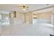 Spacious open-concept room with tile floors, seamlessly connecting the living area, kitchen, and entryway at 3601 Gainesway Trce, Duluth, GA 30096