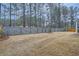 Large fenced backyard with mature trees offering privacy and shade at 3652 Silvery Way, Powder Springs, GA 30127
