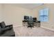 Neutral carpeted bedroom features a large window for ample natural light, perfect for a study area at 3652 Silvery Way, Powder Springs, GA 30127