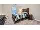 Cozy bedroom featuring a comfortable bed, a nightstand, and ample natural light at 3652 Silvery Way, Powder Springs, GA 30127