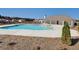 Beautiful community pool on a sunny day with a covered area and surrounding homes in the background at 3652 Silvery Way, Powder Springs, GA 30127