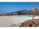 Sparkling community pool surrounded by concrete, perfect for hot summer days at 3652 Silvery Way, Powder Springs, GA 30127