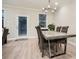 Dining area featuring a modern table with seating and abundant natural light at 3652 Silvery Way, Powder Springs, GA 30127