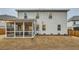 Two-story home featuring a cozy, screened-in porch overlooking a spacious backyard at 3652 Silvery Way, Powder Springs, GA 30127