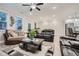 Bright and spacious living room area featuring comfortable seating, fireplace, and access to kitchen at 3652 Silvery Way, Powder Springs, GA 30127
