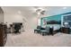 Spacious primary bedroom with a ceiling fan, desk, and a blue accent wall at 3652 Silvery Way, Powder Springs, GA 30127