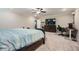 Large main bedroom showcasing a ceiling fan, office space, and a large bed at 3652 Silvery Way, Powder Springs, GA 30127