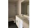 Modern bathroom featuring a double sink vanity and tiled shower/tub at 5907 Sw Bunting Ln, Atlanta, GA 30331