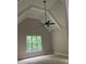 Bright bedroom with vaulted ceiling, a ceiling fan, and a window offering a private view at 5907 Sw Bunting Ln, Atlanta, GA 30331