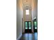 Stunning foyer featuring a soaring ceiling, elegant chandelier, and beautiful double front doors at 5907 Sw Bunting Ln, Atlanta, GA 30331