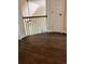 Well-lit upstairs hallway showcasing beautiful hardwood floors at 5907 Sw Bunting Ln, Atlanta, GA 30331
