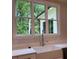 Kitchen sink and faucet with a view of a backyard at 5907 Sw Bunting Ln, Atlanta, GA 30331