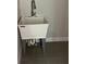 Laundry room featuring a sink, modern faucet, and tile floors at 5907 Sw Bunting Ln, Atlanta, GA 30331