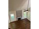 Bright living room with hardwood floors, fireplace, and fan at 5907 Sw Bunting Ln, Atlanta, GA 30331