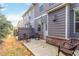 Cozy backyard patio with three rocking chairs and fenced yard, perfect for relaxation and entertaining at 1227 Herty Dr, Marietta, GA 30062