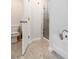 Modern bathroom with a tiled floor, walk-in shower, a luxurious soaking tub, and toilet at 1227 Herty Dr, Marietta, GA 30062