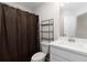 Neutral bathroom features toilet, shelving, and sink with vanity at 1227 Herty Dr, Marietta, GA 30062