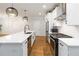 Modern kitchen features a large island, stainless steel appliances, and sleek countertops at 1227 Herty Dr, Marietta, GA 30062