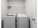 Convenient laundry room featuring new Samsung washer and dryer, plus shelving for storage at 1227 Herty Dr, Marietta, GA 30062