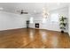 Hardwood floors complement this bright living space, featuring a fireplace and ceiling fan at 1227 Herty Dr, Marietta, GA 30062
