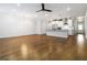 Spacious living room with hardwood floors flows into modern kitchen with granite counters at 1227 Herty Dr, Marietta, GA 30062