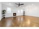 Spacious living room with hardwood floors, fireplace, recessed lighting, and natural light from windows at 1227 Herty Dr, Marietta, GA 30062