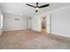 Large main bedroom boasts neutral carpet, ceiling fan, with ensuite bath and walk-in closet at 1227 Herty Dr, Marietta, GA 30062