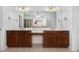 Bathroom with double vanities, a large mirror, and good lighting at 448 Hanover Drive, Villa Rica, GA 30180