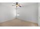 Cozy bedroom with neutral carpet, a ceiling fan, and large window at 448 Hanover Drive, Villa Rica, GA 30180