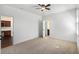 Bedroom with plush carpet, neutral walls, and ensuite bathroom and office at 448 Hanover Drive, Villa Rica, GA 30180