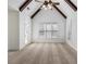 Spacious bedroom with high ceilings, wooden beams, carpeted floor, and bright windows at 448 Hanover Drive, Villa Rica, GA 30180