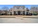 A luxurious clubhouse with a welcoming entrance and a neatly maintained brick-paved walkway at 448 Hanover Drive, Villa Rica, GA 30180