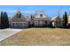 Charming single-story home boasts a brick facade, arched windows, and a well-manicured front lawn at 448 Hanover Drive, Villa Rica, GA 30180
