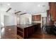 Open-concept kitchen with a large island, dark cabinetry, and seamless access to the living area at 448 Hanover Drive, Villa Rica, GA 30180