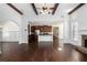 Spacious open-concept living area with hardwood floors, connecting to the kitchen and dining areas at 448 Hanover Drive, Villa Rica, GA 30180