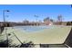 Well-maintained community tennis courts, surrounded by lush landscaping and fencing at 448 Hanover Drive, Villa Rica, GA 30180