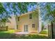 The backyard features a well-maintained lawn, a small patio, and mature trees offering shade at 4812 Browns Mill Ferry Rd, Lithonia, GA 30038
