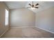 Relaxing bedroom with carpet floors, a ceiling fan, and plenty of natural light streaming through the windows at 4812 Browns Mill Ferry Rd, Lithonia, GA 30038