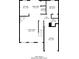 First floor plan featuring kitchen, living room, dining area, bedroom, bath, laundry, and garage at 4812 Browns Mill Ferry Rd, Lithonia, GA 30038