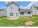 Exterior back of house shows a lush lawn, mature trees, and a patio area at 4889 Hidden Creek Pl, Decatur, GA 30035